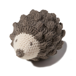Knitted hedgehog toy on a white background