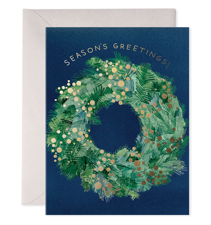 Greeting card with a festive wreath design and 'Season's Greetings!' text on a blue background.