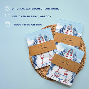 Tea towels with ski lift design wrapped in kraft paper packaging