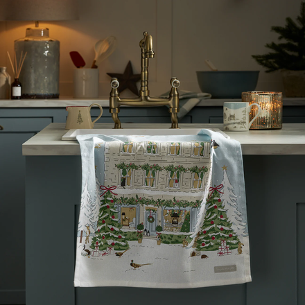 Decorative towel with festive design on a kitchen counter
