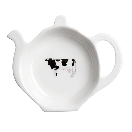 White teabag holder with a black and white cow design on a white background
