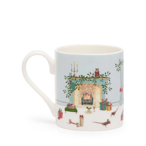 Mug with festive design of a fireplace and Christmas elements on a light blue background