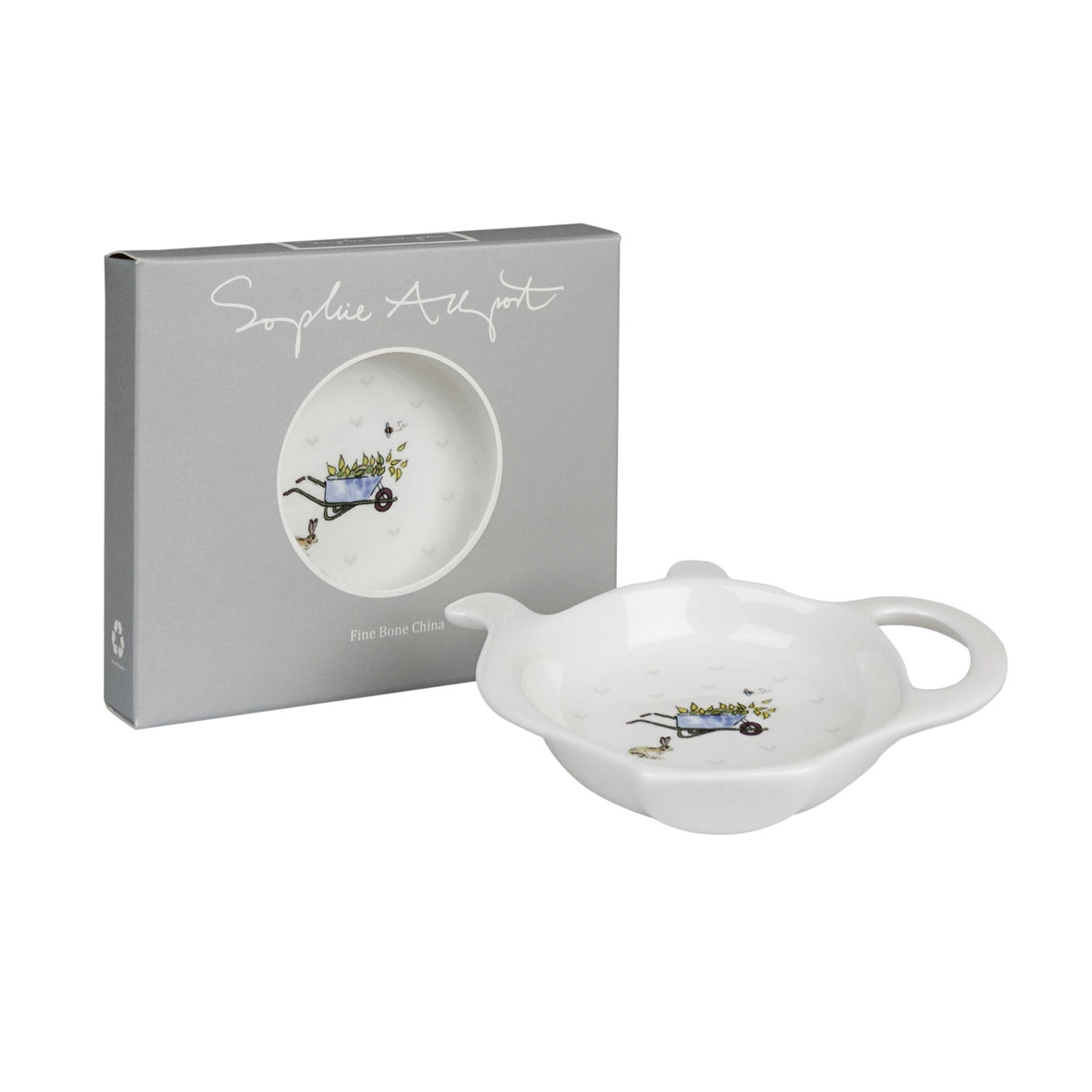 White ceramic tea bag tidy with decorative elements next to a branded box on a white background