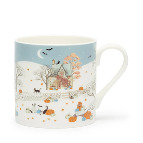 Mug with autumn-themed design featuring a house, pumpkins, and cats on a blue background.