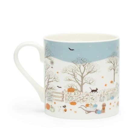 Mug with a fall scene design featuring trees, pumpkins, and animals on a white background.