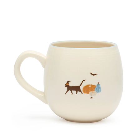 White mug with cat and bird illustrations on a white background