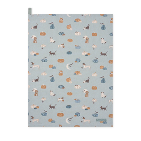Patterned paper with dogs, cats, and pumpkins on a blue background