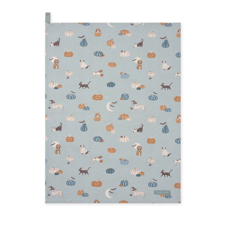 Patterned paper with dogs, cats, and pumpkins on a blue background