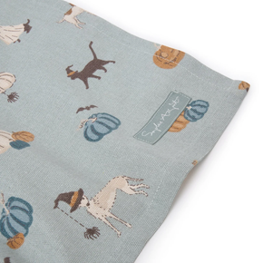 Tea towel with animal pattern and Sophie Allport label on a light blue background