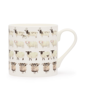 White mug with black and white sheep pattern on a white background