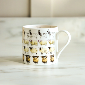 White mug with sheep pattern on a marble surface