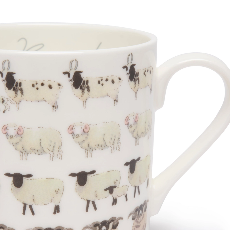 White mug with sheep pattern on a white background