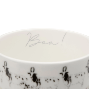 White ceramic mug with black text and patterns on a white background