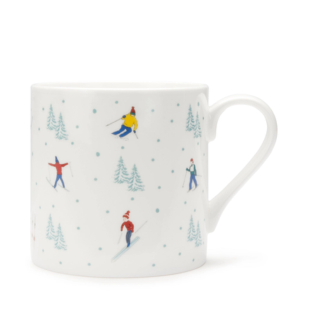 White mug with skiing design on a white background