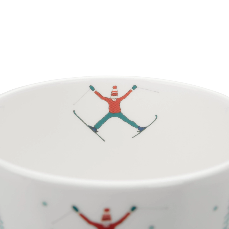 White mug with a skier design on a white background