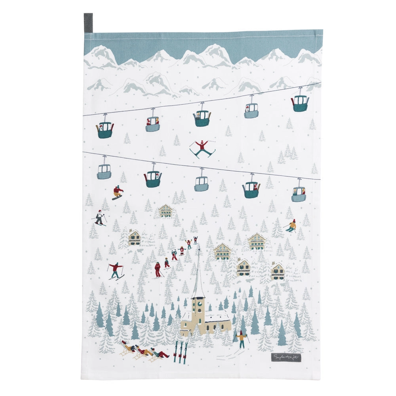 Tea towel with a winter scene design featuring people skiing and snow-covered mountains.