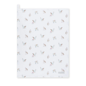 White tea towel with owl pattern on a white background