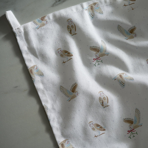 Tea towel with owl pattern on a light background
