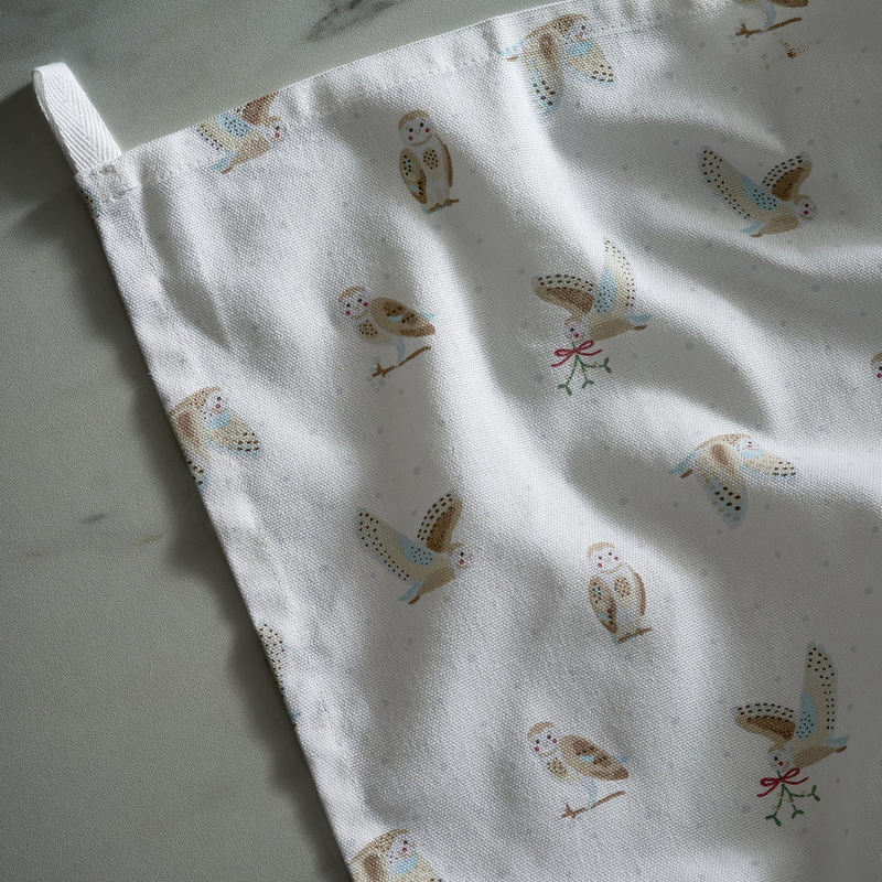 Tea towel with owl pattern on a light background