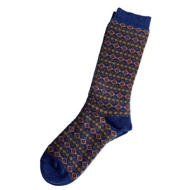 Patterned sock with blue accents on a white background