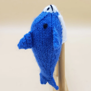Blue and white finger puppet shaped like a dolphin