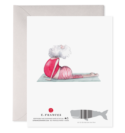 Framed artwork of Santa doing yoga with a white background, featuring the brand 'E. Frances'.