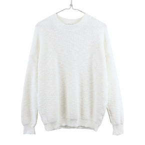 White sweater on a hanger against a white background
