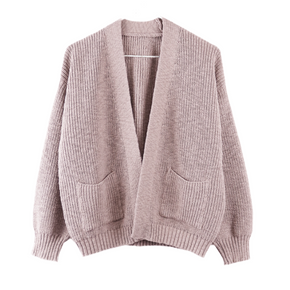 Pink knitted cardigan on a white background