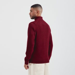 Man wearing a red sweater on a white background