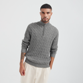Man wearing a gray sweater with a zipper on a white background