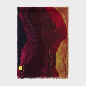 Colorful abstract patterned shawl with a visible brand label on a white background