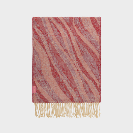 Striped scarf with fringes on a light gray background