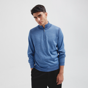 Man wearing a blue sweater with a zipper on a white background