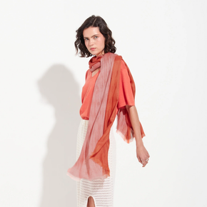 Woman wearing a colorful scarf on a white background