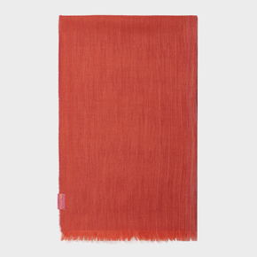 Red woven shawl with a small pink tag on a white background
