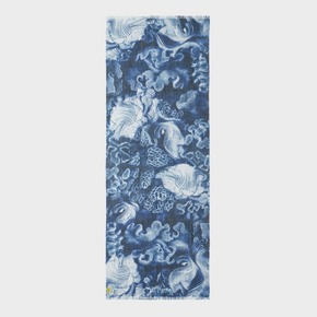 Shawl with blue and white abstract design on a light gray background