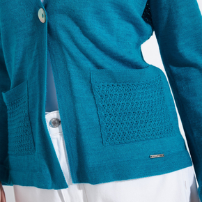 Close-up of a teal sweater with textured pocket design on a white background