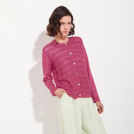 Woman wearing a pink cardigan on a white background