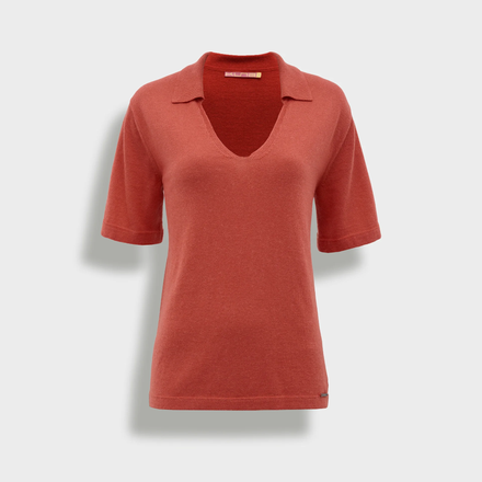Orange polo shirt on a light gray background