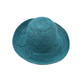 Turquoise straw hat with a decorative bow on a white background