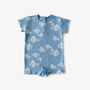 Blue baby romper with white fish pattern on a white background