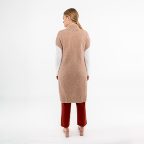 Back view of beige alpaca poncho, emphasizing luxurious, breathable fabric.