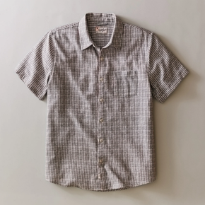 Plaid short-sleeve shirt on a light gray background