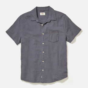 Blue short-sleeve shirt with button details on a light gray background