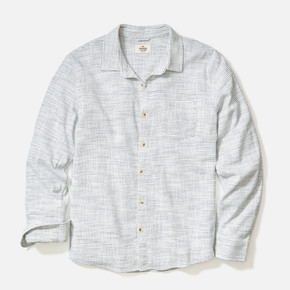 Striped shirt with button details on a light gray background