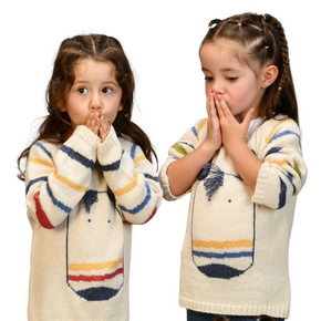 Two children wearing colorful striped sweaters on a white background