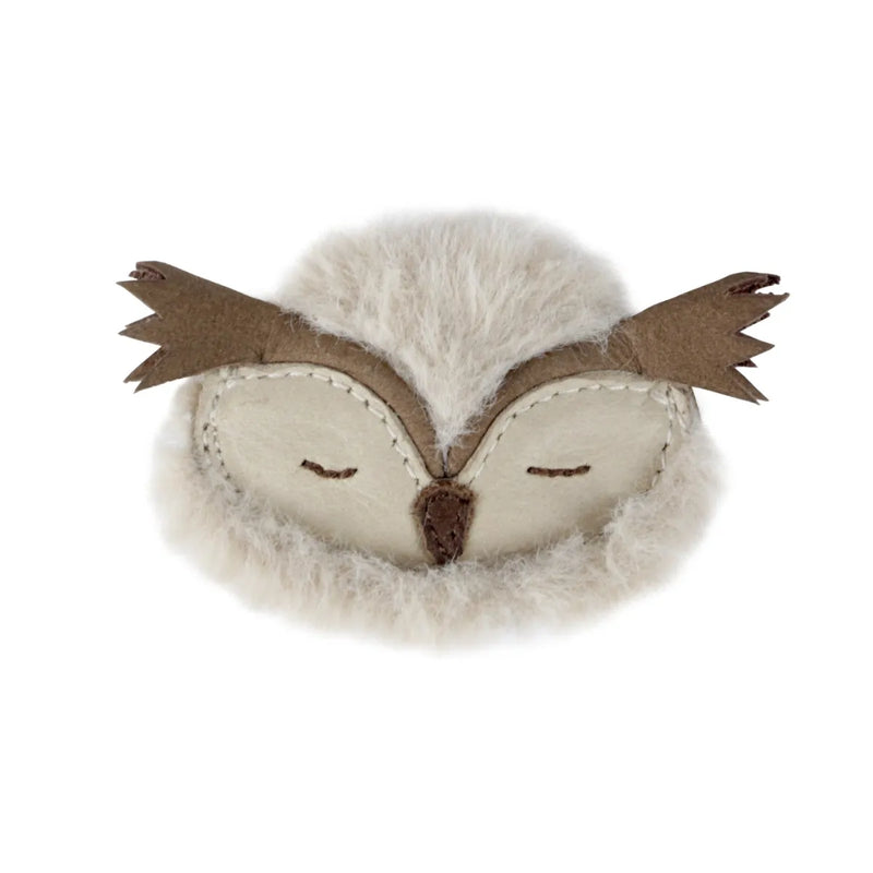 Donsje Britta Owl Purse - owl head shaped purse made from leather and faux fur on a neutral background