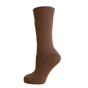Brown sock on a wooden block with a white background