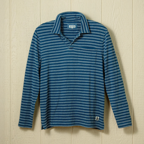 Blue striped long sleeve polo on a neutral background.