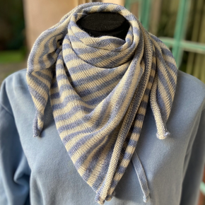 Light blue and white striped scarf wrapped around mannequin